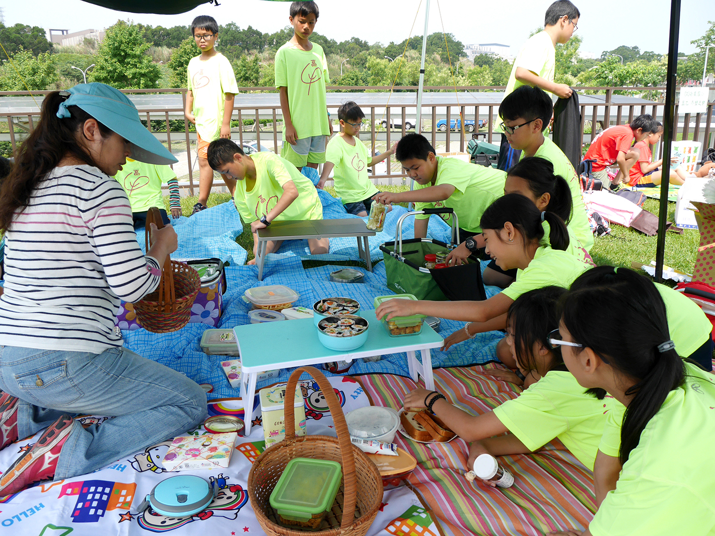 Children chat on the small picnic mat