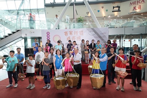 A Group Photo Of The Carrying Loads Ceremony