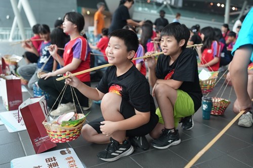 Students Carry The Poles